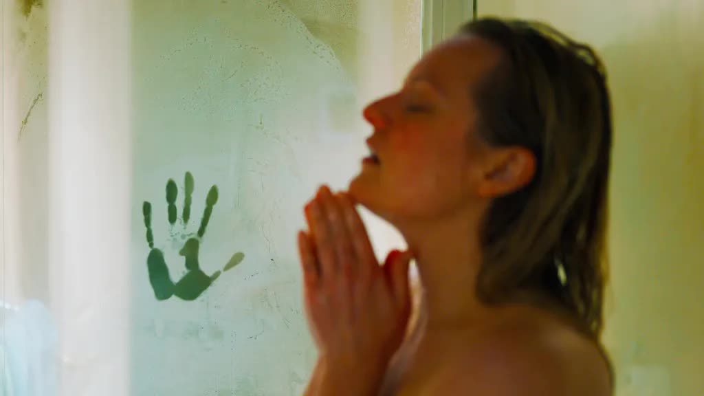 Elizabeth Moss with a handprint in The Invisible Man