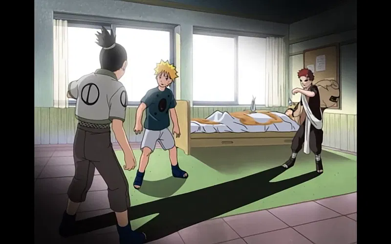 Shikamaru grimaces in pain as Gaara is punched