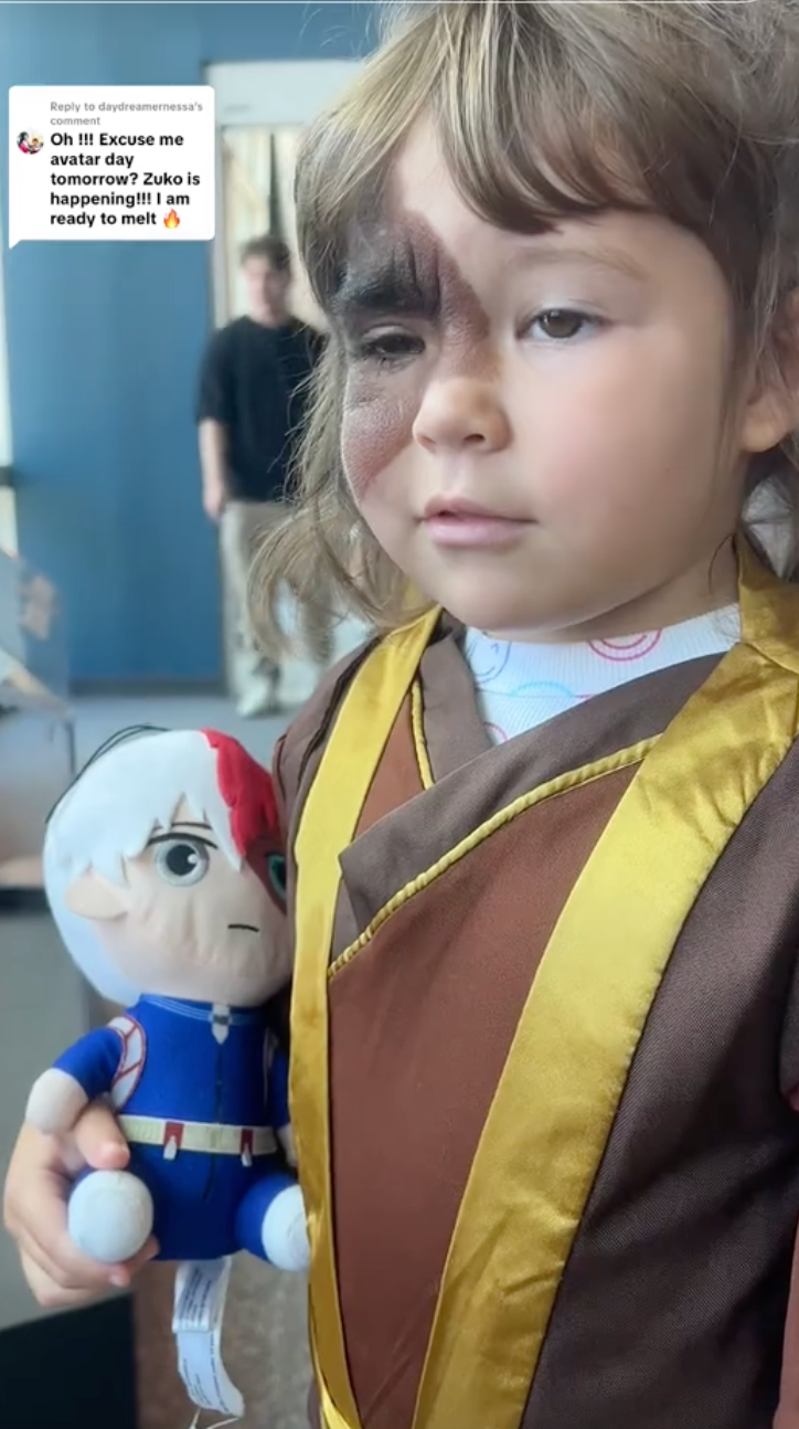Winry holding Todoroki figure, smiling