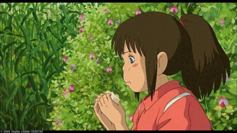 Chihiro eating rice ball and crying