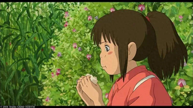 Chihiro eating rice ball and crying